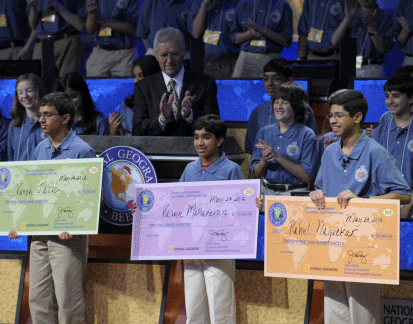 National Geographic Bee host Alex Trebek, rear center, and others, applaud the National Geographic Bee top winners, from left, Vansh Jain, from Minocqua-Hazel-hurst-Lake Tomahawk Elementary School in Minocqua, Wis.; Varun Mahadevan, from Prince of Peace Christian School in Fremont, Calif.; and champion Rahul Nagvekar, 14, from Quail Valley Middle School in Missouri City, Texas., Thursday, May 24, 2012, in Washington. AP