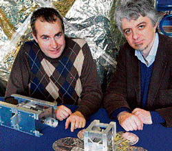 state-of-the-art Doctoral student Thomas Sinn (left) and Massimiliano Vasile with a test satellite.