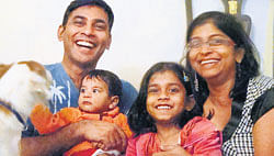 COMPLETE FAMILIES: Keith, Nisha and the kids, and (below) Deval, Sandeep and their children.