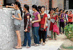Aspirants queue up to buy OMR forms for admission to DU.