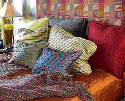 bright spots A dull sofa can be compensated for, by adding colourful cushions  and throw pillows. Getty Images