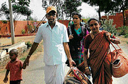 Alls not well: In the aftermath of the trouble at the ashram, disciples of Nithyananda leave Bidadi on Saturday. dh Photo