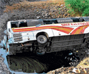 TRAGIC END: The ill-fated private passenger bus that fell off a river bridge near Osmanabad town on Saturday.  PTI