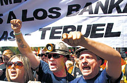 Miners take part in a demonstration in Madrid to protest against cuts in government subsidies to the sector. Spanish coal miners are staging a nationwide strike action organised by unions opposed to subsidy reductions from euros 300 million to euros 110 million. AFP