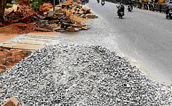 Road widening work has affected movement of vehicles on Mysore Road.