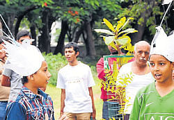 Two boys dressed as birds enact a play at Peoples Park as part of a protest in Mysore on Sunday. dh photo