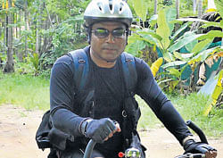 Saju Depalan on his bicycle