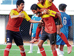 JUBILANT Postals Sharath (centre) celebrates with team-mates Chethan Kumar (left) and Gopi after scoring against KSP during their Super Division tie. DH&#8200;PHOTO