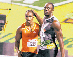 watch out:  Usain Bolt (left) will have to ward off Yohan Blake to retain his 100 and 200 Olympic gold at the London Olympics.