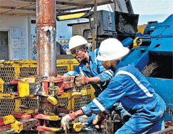 Black gold: Tullow Oil drillers in Uganda, where a 1.1-billion-barrel oil field was discovered in 2006, in  an undated handout photo. Since 2006, Tullow Oil has made major discoveries in Kenya, Uganda and off the coasts of Ghana and French Guiana by focusing on geologically similar regions in Africa and Latin America. NYT