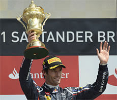 Red Bull Formula One driver Mark Weber of Australia celebrates winning the British F1 Grand Prix at Silverstone, central England on Sunday. REUTERS