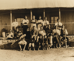 This handout reproduction photograph taken in Britain and released by Sotheby's auction house on July 10, 2012, shows a historical photograph showing Mohandas Karamchand Gandhi and Hermann Kallenbach (middle row, centre) at Tolstoy Farm, South Africa in 1910. India has paid 1.1 million USD to buy a collection of letters, papers and photographs relating to Indian independence icon Mahatma Gandhi, preventing their sale at a planned auction in London. The archive, which belonged to Gandhi's close friend Hermann Kallenbach, a German Jewish bodybuilder and architect, was to have gone under the hammer at Sotheby's on July 11. 'AFP PHOTO / SOTHEBY