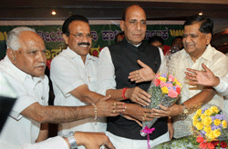 Jagadish Shettar (R) being greeted by BJP leader Rajnath Singh, outgoing Karnataka Chief Minister Sadananda Gowda and BS Yeddyurappa after he was formally elected as the BJP legislature party leader, in Bengaluru on Tuesday. PTI Photo