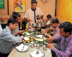 gourmet central Food lovers enjoy a wholesome meal at the Karnataka Sangha Food Centre.