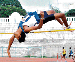 soaring high: Youngsters Sports Clubs Chethan set a new record in the mens high jump event of the State Junior and Senior athletics championship on Wednesday. DH&#8200;PHOTO