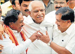 Moment of mirth: Chief Minister Jagadish Shettar has a hearty laugh with Deputy Chief Minister K S Eshwarappa and  former chief minister B S Yeddyurappa at the oath-taking ceremony at Raj Bhavan on Thursday. KPN