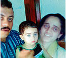 B Hussain with wife and kid.