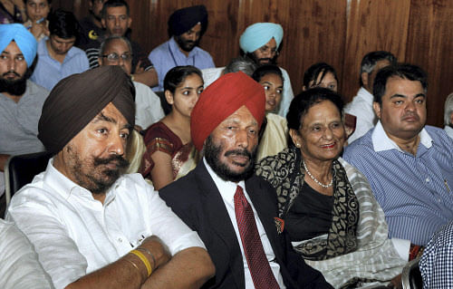 Former athlete Milkha Singh (red turban) with others at the golden jubilee celebration of Post Graduate Institute (PGI) of Medical Research and Education in Chandigarh on Saturday. PTI Photo