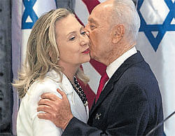 Israels President Shimon Peres kisses US Secretary of State Hillary Clinton after a meeting in Jerusalem. Reuters