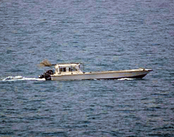 This US Navy photo shows a small vessel that was fired upon by the US Navy off Dubai's coast on July 16, 2012. The shooting happened Monday afternoon when a boat rapidly approached the refueling ship USNS Rappahannock about 10 miles (16 kilometers) off Dubai's Jebel Ali port, according to the US Navy. The Navy said the boat's crew disregarded warnings from the US vessel, and only then did gunners fire on it with a .50-caliber machine gun. But An Indian fisherman aboard the boat shot at by the US Navy off Dubai's coast has told officials the crew received no warning before being fired upon, India's ambassador to the United Arab Emirates said on July 17. One Indian was killed in the incident, and three of his countrymen were seriously wounded. Emirati and American officials both say they are investigating. AFP PHOTO