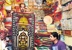 brisk business Prayer mats sell well during this season. DH Photos by Dinesh S K
