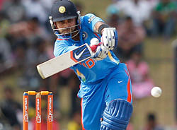 India's Virat Kohli plays a shot during the first One Day International cricket match against Sri Lanka in Hambantota July 21, 2012. REUTERS/Dinuka Liyanawatte