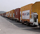 Lorries loaded with new manufactured cars at the violence-hit Maruti Suzuki plant in Manesar on Saturday. PTI