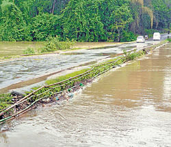 Danger level: The bridge across the Kumaradhara river near Hosmata, which was inundated following heavy rain. It is a key link to the pilgrimage town of Subramanya. dh photo