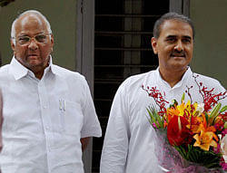 Union Minister and NCP chief Sharad Pawar with party leader Praful Patel arrives to greet President-elect Pranab Mukherjee at his residence in New Delhi on Monday. PTI