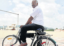 M&#8200;M&#8200;Ananth displays the electric cycle in Mysore on Tuesday. dh photo
