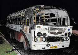 Charred: A KSRTC bus torched by a mob following the murder of B&#8200;M&#8200;L Krishnappa at  Nelamangala on Wednesday night. dh Photo / s k dinesh