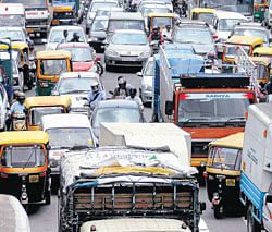 crowded (Top and left) Bumper-to-bumper traffic on Sheshadri Road. DH Photos by Satish Badiger