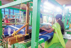 Women workers at one of the handloom training centers. dh photos