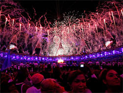 Fireworks illuminate the sky as the Olympic cauldron is lit during the Opening Ceremony at the 2012 Summer Olympics, Saturday, July 28, 2012, in London. AP