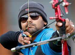 India's Rahul Banerjee takes aim during the men's archery team eliminations at the Lords Cricket Ground during the London 2012 Olympics Games July 28, 2012. REUTERS