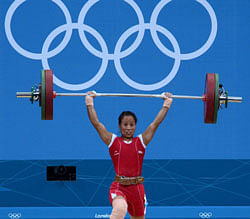 India's Soniya Chanu Ngangbam competes during the women's weightlifting 48kg group A at the Excel Center during the London 2012 Olympic Games on Saturday.PTI
