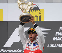 McLarens Lewis Hamilton celebrates after his win in Budapest. AFP