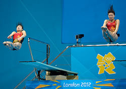 Wu Minxia of China, left, and He Zi compete during the 3 Meter Synchronized Springboard final at the Aquatics Centre in the Olympic Park during the 2012 Summer Olympics in London, Sunday, July 29, 2012. China won the gold medal in the event. AP