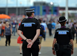 Police officers patrol at the Olympic Park in London. AFP