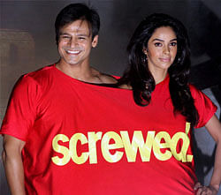 Bollywood actors Vivek Oberoi and Mallika Sherawat pose for a photo during a promotional event for their upcoming film 'Kismat Love Paisa Dilli' in Mumbai on Sunday. PTI