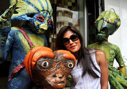 Indian Bollywood actress Chitrangada Singh poses for a photo with performers dressed as aliens during a promotion for the Hindi film Joker directed by Shirish Kunder in Mumbai . AFP