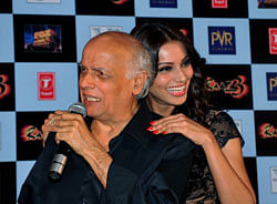 Indian Bollywood film actors Bipasha Basu (R) poses with producer Mahesh Bhatt during the launch of the first trailer of upcoming Hindi horror thriller film 'Raaz 3' directed by Vikram Bhatt in Mumbai. AFP