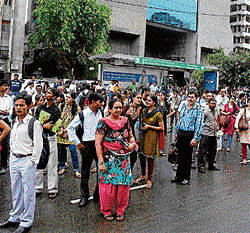 mad hour Commuters crowd a bus stop after Metro came to a halt due to power failure.