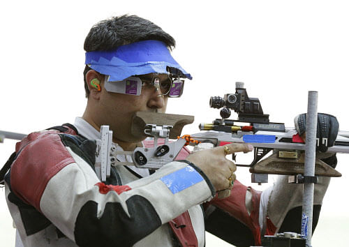 India's Gagan Narang prepares to shoot, during qualifiers for the men's 50-meter rifle 3 positions, at the 2012 Summer Olympics, Monday, Aug. 6, 2012, in London. (AP Photo/Rebecca Blackwell)