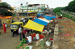 difficult: A view of the vegetable market in Mandya. dh photo