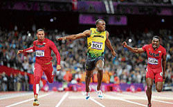 REMARKABLE feat: Runners compete in the men's 100-metre track competition at the 2012 Summer Olympic Games in London. Usain Bolt (centre) of Jamaica  won the gold medal. NYT