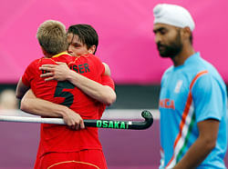 Belgium's Jerome Dekeyser is congratulated by teammate Felix Denayer after he scored a goal against India during their men's group B hockey match at the Riverbank Arena at the London 2012 Olympic Games August 7, 2012. REUTERS