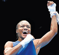 strongwoman Britains Nicola Adams celebrates after  winning the gold in the womens 51 kg class on Thursday. AFP