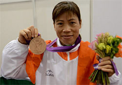 India's Mary Kom with bronze medal in boxing of the London 2012 Olympic Games at Olympic Stadium on Thursday. PTI