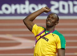 Jamaica's Usain Bolt celebrates with his gold medal during the presentation ceremony for the men's 200m event at the London 2012 Olympic Games at the Olympic Stadium August 9, 2012. REUTERS